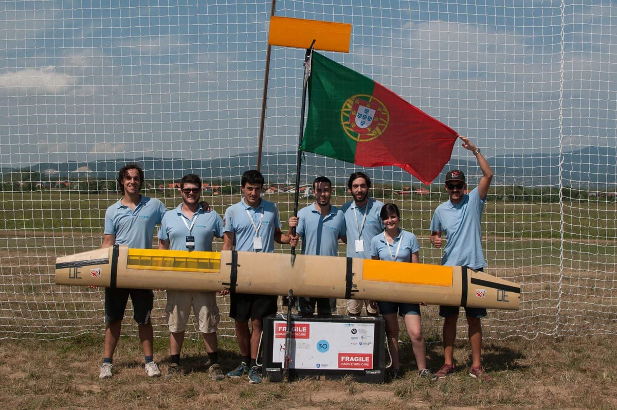 The Air Cargo Challenge 2017 team holding their aircraft, with the Portuguese flag