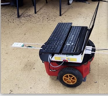 A Pioneer robot carrying a laptop and ultra-wideband range sensors